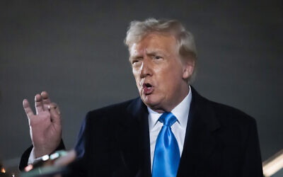US President Donald Trump speaks to reporters next to Air Force One after arriving back at Joint Base Andrews, Maryland, February 2, 2025. (Ben Curtis/AP)