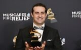 Dan Pugach of Dan Pugach Big Band, winner of the award for best large jazz ensemble album for 'Bianca Reimagined: Music for Paws and Persistence,' poses in the press room during the 67th annual Grammy Awards on in Los Angeles, February 2, 2025. (Richard Shotwell/Invision/AP)