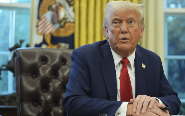 US President Donald Trump speaks as he signs executive orders in the Oval Office of the White House, February 3, 2025, in Washington. (AP Photo/Evan Vucci)