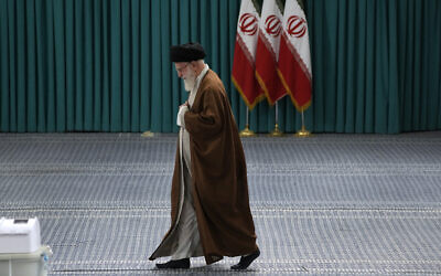 Iranian Supreme Leader Ayatollah Ali Khamenei arrives to vote for the parliamentary runoff elections, in Tehran, Iran on May 10, 2024. (AP Photo/Vahid Salemi)