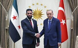 Turkish President Recep Tayyip Erdogan, right, shakes hands with Syria's interim President Ahmed al-Sharaa during their meeting at the presidential palace, in Ankara, Turkey, February 4, 2025. (Turkish Presidency via AP)