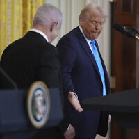 US President Donald Trump shakes hands with Prime Minister Benjamin Netanyahu after a news conference in the East Room of the White House, on February 4, 2025, in Washington. (AP Photo/Evan Vucci)
