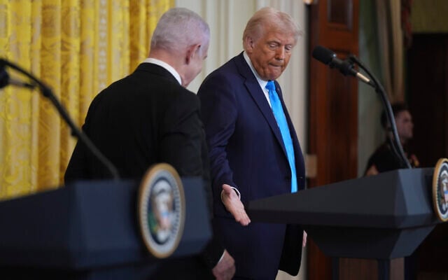 US President Donald Trump shakes hands with Prime Minister Benjamin Netanyahu after a news conference in the East Room of the White House, on February 4, 2025, in Washington. (AP Photo/Evan Vucci)