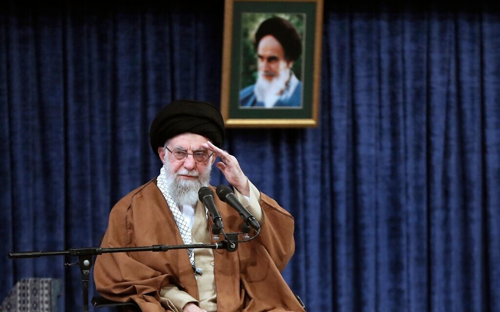In this photo released by an official website of the office of the Iranian supreme leader, Ayatollah Ali Khamenei salutes in a meeting with a group of air force officers in Tehran, Iran, February 7, 2025. (Office of the Iranian Supreme Leader via AP)
