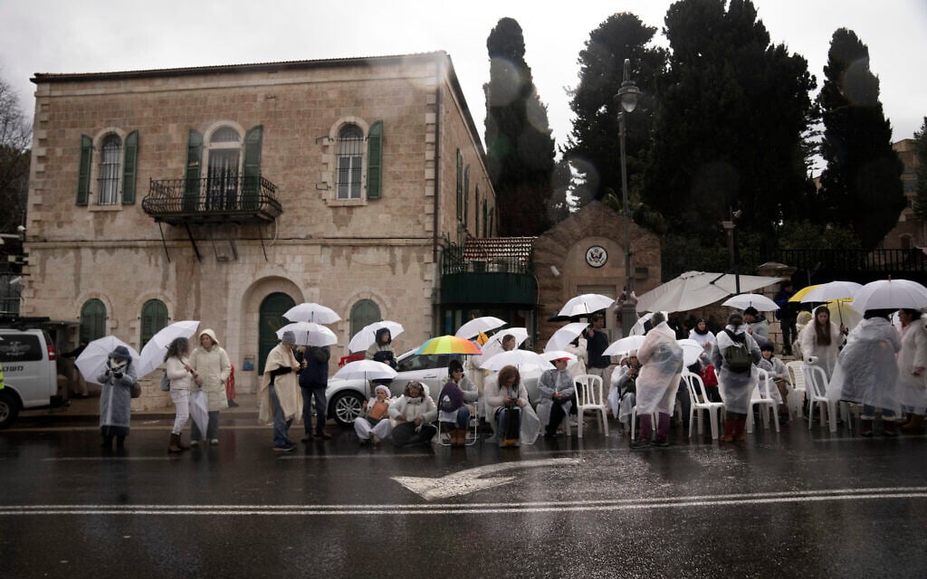 Women from Mishmeret 101 take part in a silent sit-in at the US Consulate building in Jerusalem to urge the government to complete all phases of the hostage deal to bring everyone home, February 7, 2025. (AP Photo/Maya Alleruzzo)