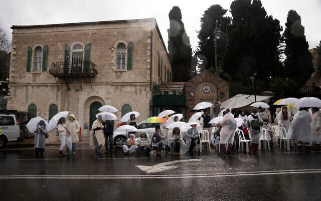Women from Mishmeret 101 take part in a silent sit-in at the US Consulate building in Jerusalem to urge the government to complete all phases of the hostage deal to bring everyone home, February 7, 2025. (AP Photo/Maya Alleruzzo) Women from Mishmeret 101 take part in a silent sit-in at the US Consulate building in Jerusalem to urge the government to complete all phases of the hostage deal to bring everyone home, February 7, 2025. (AP Photo/Maya Alleruzzo)