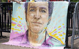 A drawn portrait of Marc Fogel, who was detained in Russia in August 2021, hangs on rails outside of the White House during a demonstration organized by his family, July 15, 2023, in Washington. (Stephanie Scarbrough/AP)