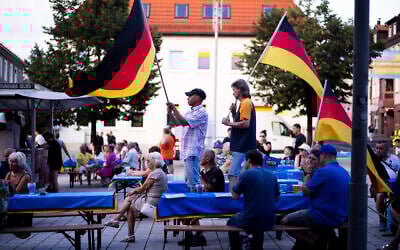 Supporters of the far-right AfD party at an election campaign rally in Suhl, Germany, August 13, 2024. (Markus Schreiber/AP).