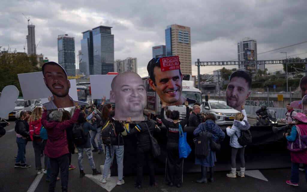 Relatives and supporters of Israelis held hostage in the Gaza Strip, hold photos depicting their faces during a protest demanding their release from Hamas captivity, in Tel Aviv, Israel, Thursday, Feb. 13, 2025. (AP/Oded Balilty)