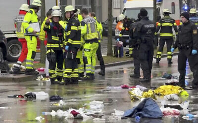Emergency services attend the scene after a driver hit a group of people in Munich, Germany, February 13, 2025. (Peter Kneffel/dpa via AP)