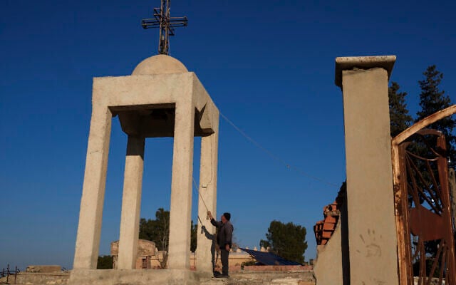 Ishaq Nissan, a Syriac Orthodox Christian, rings the church bell in the northeastern Syrian village of Tel Tal, currently controlled by the US-backed, Kurdish-led Syrian Democratic Forces, January 27, 2025. (AP/Bernat Armangue) Ishaq Nissan, a Syriac Orthodox Christian, rings the church bell in the northeastern Syrian village of Tel Tal, currently controlled by the US-backed, Kurdish-led Syrian Democratic Forces, January 27, 2025. (AP/Bernat Armangue)