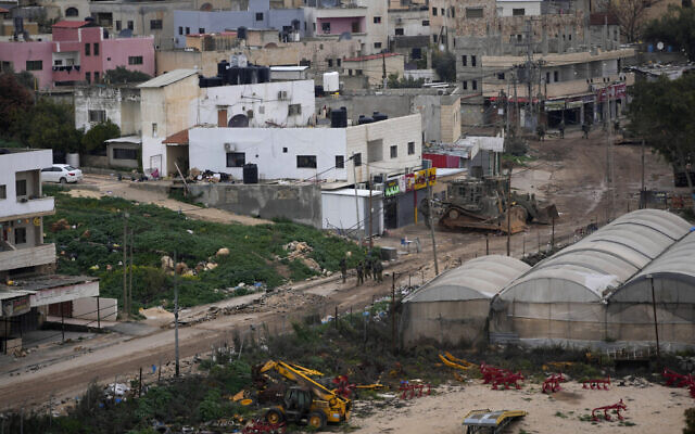 Israeli soldiers are seen operating inside the Far'a refugee camp, near the West Bank city of Tubas, February 11, 2025. (AP Photo/Nasser Nasser)