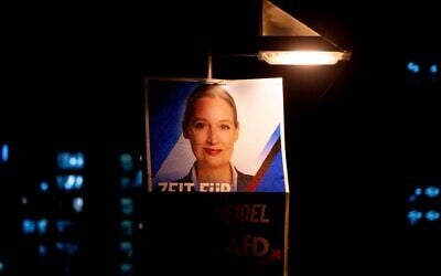 An election poster showing AfD top candidate for chancellor Alice Weidel is fixed on a lamp pole in Frankfurt, Germany, February 20, 2025. (AP Photo/Michael Probst)