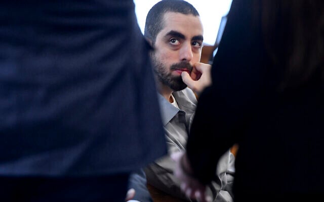 Hadi Matar, charged with severely injuring author Salman Rushdie in a 2022 knife attack, listens to his defense team in Chautauqua County court in Mayville, N.Y., Thursday, Feb. 20, 2025. (AP Photo/Adrian Kraus) Hadi Matar, charged with severely injuring author Salman Rushdie in a 2022 knife attack, listens to his defense team in Chautauqua County court in Mayville, N.Y., Thursday, Feb. 20, 2025. (AP Photo/Adrian Kraus)