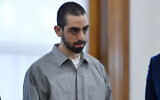 Hadi Matar, charged with severely injuring author Salman Rushdie in a 2022 knife attack, stands in Chautauqua County court in Mayville, N.Y., Friday, Feb. 21, 2025. (AP Photo/Adrian Kraus)