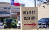 A sign is seen outside of Seminole Hospital District offering measles testing February 21, 2025, in Seminole, Texas. (AP Photo/Julio Cortez)