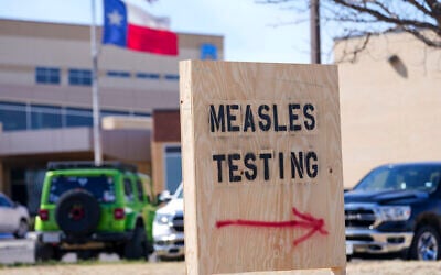 A sign is seen outside of Seminole Hospital District offering measles testing February 21, 2025, in Seminole, Texas. (AP Photo/Julio Cortez)