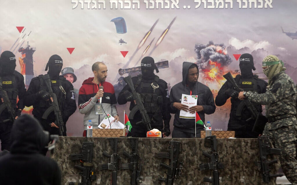 Israeli hostages Tal Shoham left, and Avera Mengisto are put on stage by Hamas in Rafah, southern Gaza Strip, on Saturday, Feb. 22, 2025. (AP/Jehad Alshrafi) Israeli hostages Tal Shoham left, and Avera Mengisto are put on stage by Hamas in Rafah, southern Gaza Strip, on Saturday, Feb. 22, 2025. (AP/Jehad Alshrafi)