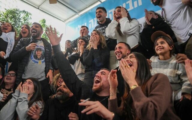 Relatives and friends of Eliya Cohen, 27, celebrate as they watch the TV broadcast of his release by Palestinian terrorists in Gaza, in Tel Aviv, February 22, 2025. (AP Photo/Ohad Zwigenberg)