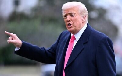 US President Donald Trump responds to reporters as he arrives at the White House after speaking at the Conservative Political Action Conference, CPAC, in Washington, February 22, 2025. (John McDonnell/AP)