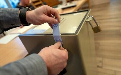 A ballot box is sealed with the electoral seal of the German State of Bavaria in Memmelsdorf, Germany, Feb. 23, 2025, during the national election. (Pia Bayer/dpa via AP)