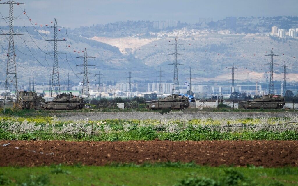 Three Israeli tanks near Jenin in the West bank Feb. 23, 2025. (AP Photo/Majdi Mohammed)