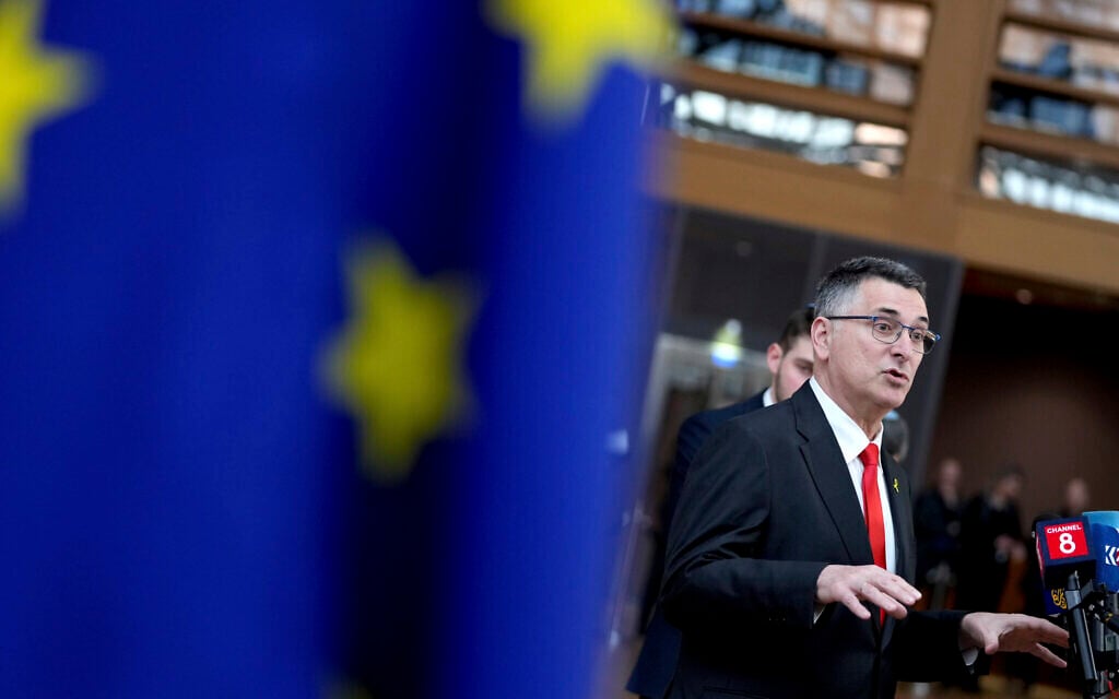 Foreign Minister Gideon Sa'ar speaks with the media as he arrives for an EU-Israel meeting at the European Council building in Brussels, February 24, 2025. (AP Photo/ Virginia Mayo)