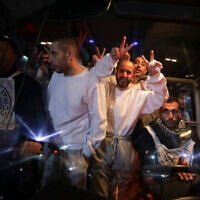 Illustrative: Freed Palestinian prisoners flash V-signs as they arrive in the Gaza Strip after being released from an Israeli prison following a ceasefire agreement between Hamas and Israel in Khan Younis, Gaza Strip on February 27, 2025. (AP Photo/Jehad Alshrafi)