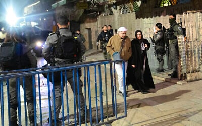 Muslim worshippers pass through a checkpoint as Israeli police deploy in the Old City of Jerusalem ahead of the Islamic holy month of Ramadan, February 27, 2025. (AP/Maya Alleruzzo)