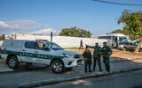 Illustrative: Police and medical personnel work a crime scene in Lod on December 15, 2021. (Yossi Aloni/Flash90)
