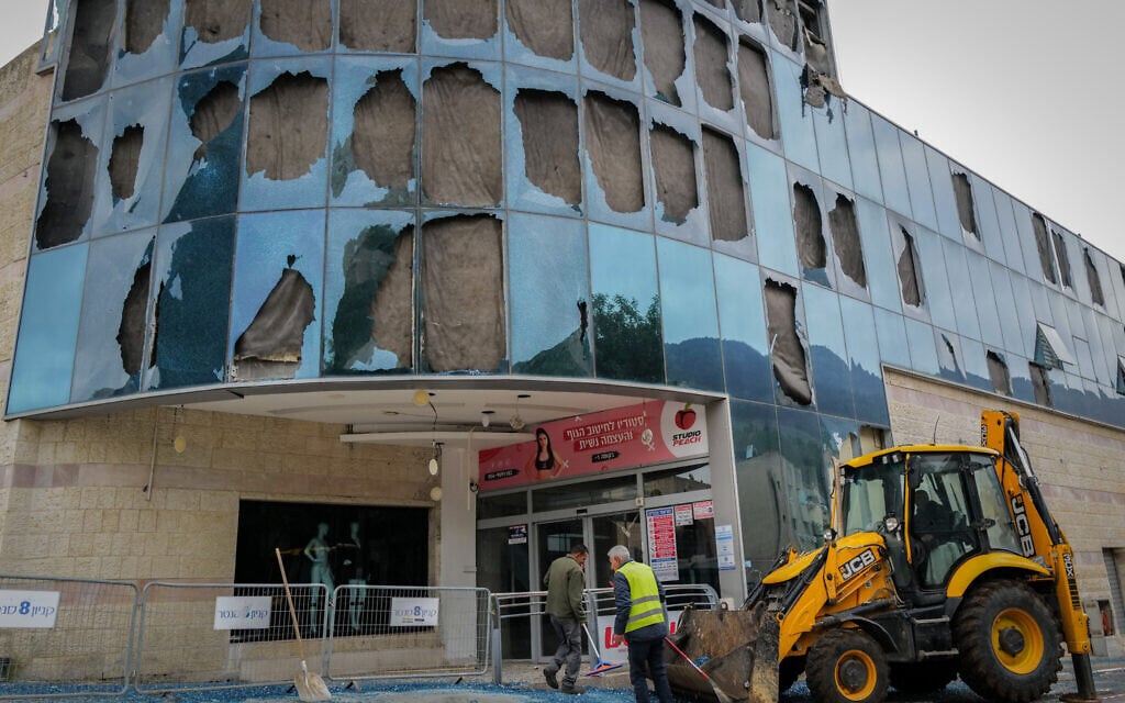 Residents of the northern city of Kiryat Shmona check the damage caused to the city's Central Bus Station and Mall after a Hezbollah missile attack, November 27, 2024. (Michael Giladi/Flash90)