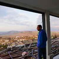 A man surveys damage caused during the recent war in Metula, on the Israeli border with Lebanon, January 2, 2025. (Yossi Zamir/ Flash90)