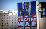 A large billboard with US President Donald Trump encouraging Prime Minister Benjamin Netanyahu to end the war, in Jerusalem, January 13, 2025. (Chaim Goldberg/Flash90)