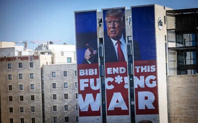 A large billboard with US President Donald Trump encouraging Prime Minister Benjamin Netanyahu to end the war, in Jerusalem, January 13, 2025. (Chaim Goldberg/Flash90)
