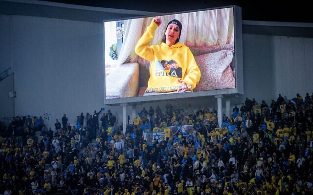 Released hostage Emily Damari speaks on a large screen during the Premier League match between Beitar Jerusalem and Maccabi Tel Aviv F.C. at the Bloomfield Stadium in Tel Aviv, February 3, 2025 (Oren Ben Hakoon/Flash90) Released hostage Emily Damari speaks on a large screen during the Premier League match between Beitar Jerusalem and Maccabi Tel Aviv F.C. at the Bloomfield Stadium in Tel Aviv, February 3, 2025 (Oren Ben Hakoon/Flash90)