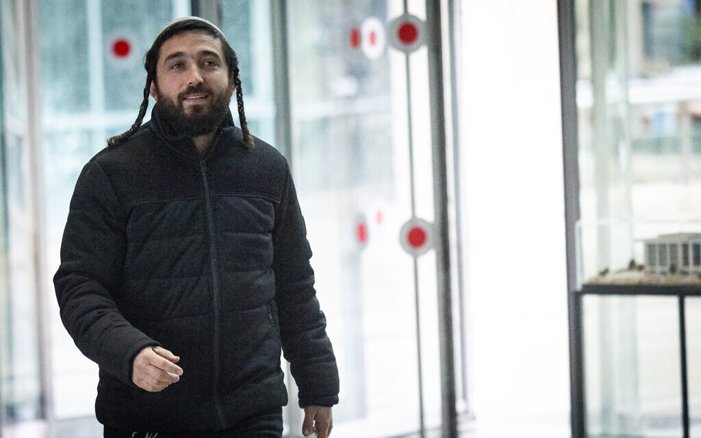 Former MK Zvi Sukkot arrives to the Department of Internal Police Investigations, in Jerusalem, February 6, 2025. (Yonatan Sindel/Flash90)