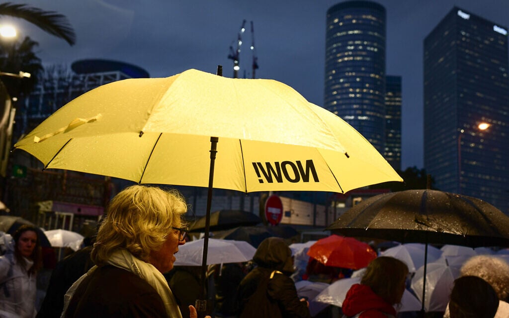 Protesters attend a silent protest calling for the release of Israelis held hostage in the Gaza Strip, outside the Kirya military headquarters in Tel Aviv on February 9, 2025. (Tomer Neuberg/Flash90)