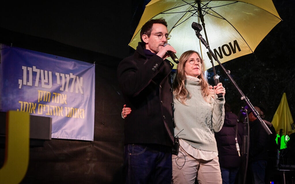 Idit Ohel, whose son Alon Ohel has been held in Gaza since October 7, 2023, with singer Ivri Lider at Hostages Square in Tel Aviv, as supporters gathered to celebrate Alon's 24th birthday, February 10, 2025. (Avshalom Sassoni/Flash90)