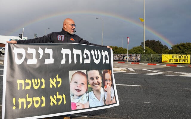 A man in northern Israel holds a sign portraying Shiri Silberstein Bibas, whose body Hamas falsely claimed to have released, and her sons, Ariel, 4, and baby Kfir, whose remains were in fact handed over, on February 20, 2025. His sign reads 'The Bibas family: We will not forgive and we will not forget!' (Ayal Margolin/Flash90) A man in northern Israel holds a sign portraying Shiri Silberstein Bibas, whose body Hamas falsely claimed to have released, and her sons, Ariel, 4, and baby Kfir, whose remains were in fact handed over, on February 20, 2025. His sign reads 'The Bibas family: We will not forgive and we will not forget!' (Ayal Margolin/Flash90)