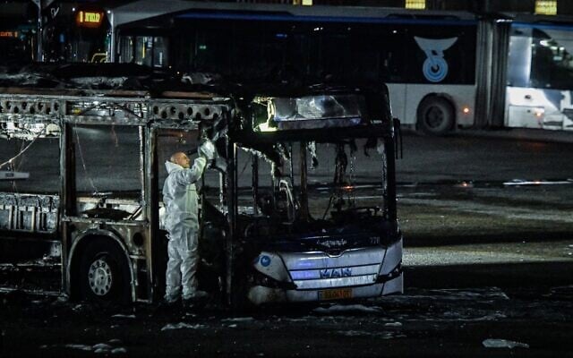 Israeli security forces probe a bus targeted by an explosive device, in Bat Yam, February 20, 2025. (Avshalom Sassoni/Flash90) Israeli security forces probe a bus targeted by an explosive device, in Bat Yam, February 20, 2025. (Avshalom Sassoni/Flash90)