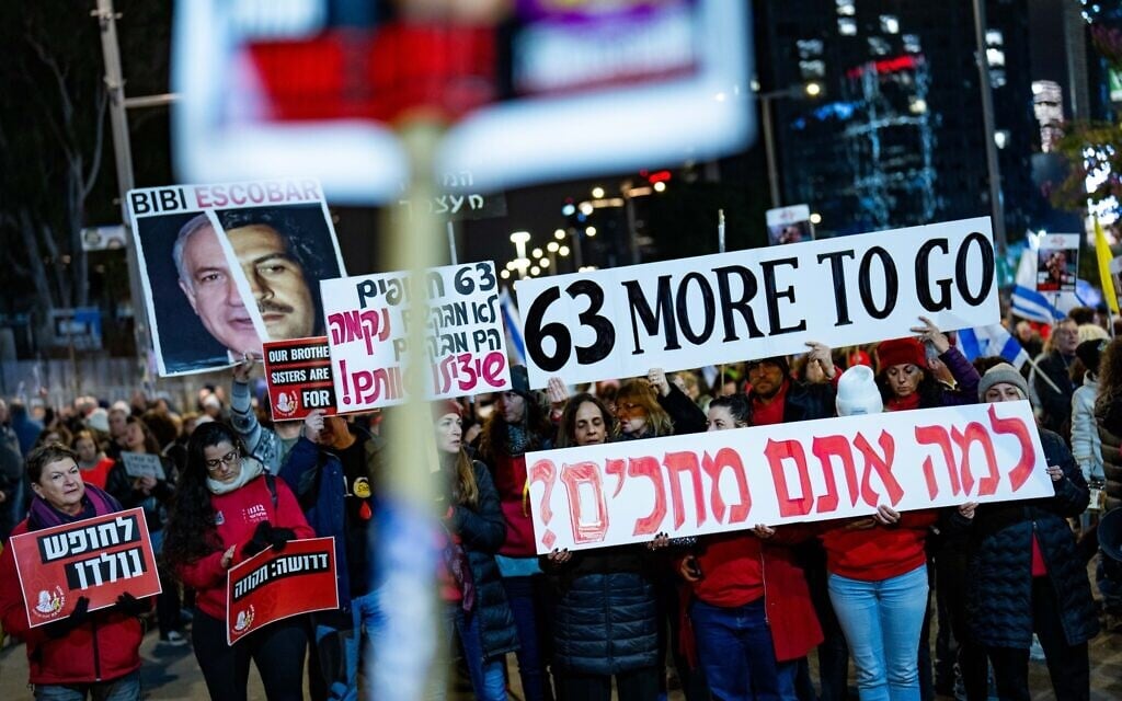 Demonstrators protest for the release of Israelis held hostage in the Gaza Strip, outside Hakirya Base in Tel Aviv, February 22, 2025. (Erik Marmor/Flash90)