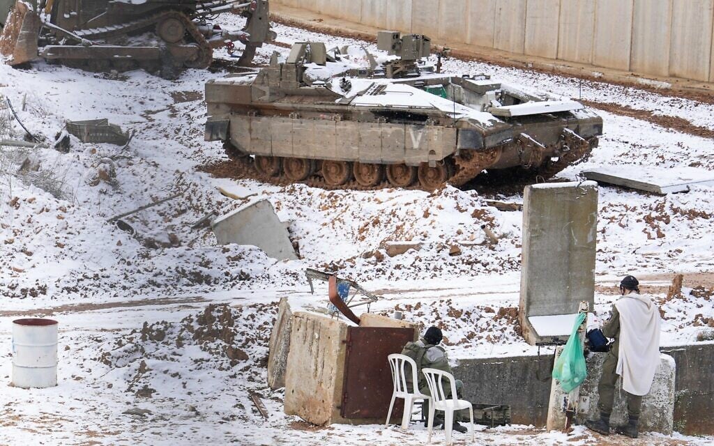 Israeli soldiers seen in the snow on the Israeli border with Lebanon, on February 24, 2025. (Ayal Margolin/Flash90)