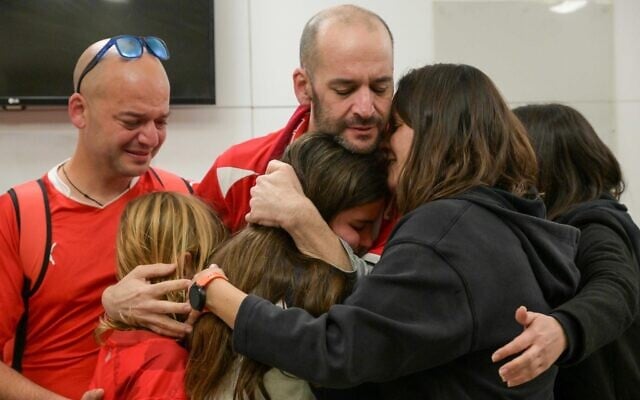 Newly-released hostage Iair Horn (center) reunites with relatives at Tel Aviv Sourasky Medical Center on February 15, 2025. (Ma'ayon Toaf / GPO)