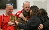 Newly-released hostage Iair Horn (center) reunites with relatives at Tel Aviv's Sourasky Medical Center on February 15, 2025. (Ma'ayon Toaf / GPO)