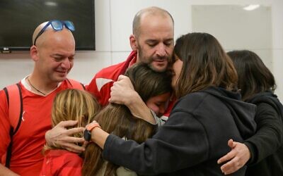 Newly-released hostage Iair Horn (center) reunites with relatives at Tel Aviv's Sourasky Medical Center on February 15, 2025. (Ma'ayon Toaf / GPO)