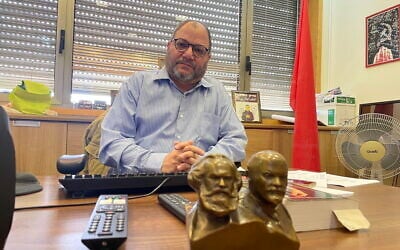 Hadash-Ta’al legislator Ofer Cassif in his Knesset office, February 19, 2025. (Sam Sokol/Times of Israel)