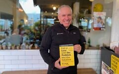 Waze co-founder Uri Levine presenting the the new edition of his book 'Fall in Love with the Problem, Not the Solution - A Handbook for Entrepreneurs.' (Shoshanna Solomon/Times of Israel)