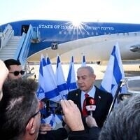 Prime Minister Benjamin Netanyahu speaks to media outlets ahead of boarding a plane to Washington on February 2, 2025. (Avi Ohayon/GPO)