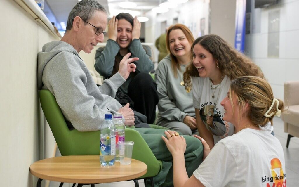 Released hostage Ohad Ben Ami reunites with his daughters Ella, Natalie and Yuli, along with his wife Raz, after his release from Hamas captivity, February 8, 2025. (IDF)