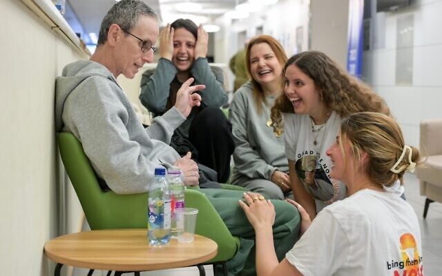 Released hostage Ohad Ben Ami reunites with his daughters Ella, Natalie and Yuli, along with his wife Raz, after his release from Hamas captivity, February 8, 2025. (IDF)